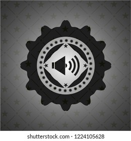 sound icon inside dark emblem