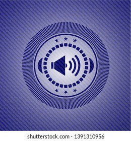 sound icon inside denim background