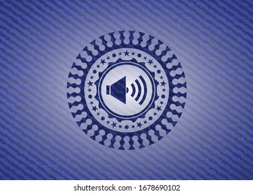 sound icon inside emblem with denim high quality background