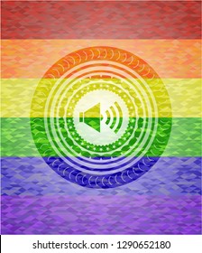 sound icon inside emblem on mosaic background with the colors of the LGBT flag