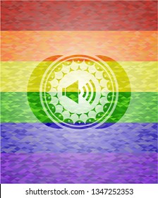 sound icon inside emblem on mosaic background with the colors of the LGBT flag