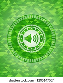 sound icon inside green emblem with mosaic background