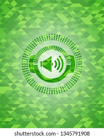 sound icon inside green emblem. Mosaic background
