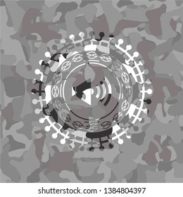 sound icon inside grey camo texture