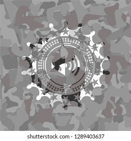 sound icon inside grey camouflage texture