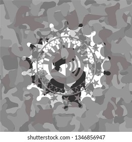sound icon inside grey camouflage emblem