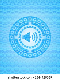 sound icon inside light blue water wave emblem.