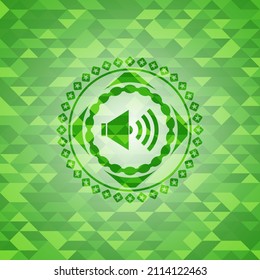 sound icon inside realistic green mosaic emblem. 
