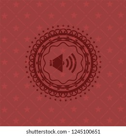 sound icon inside red emblem