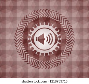sound icon inside red seamless emblem with geometric pattern background.