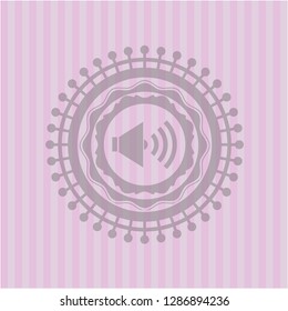 sound icon inside retro style pink emblem