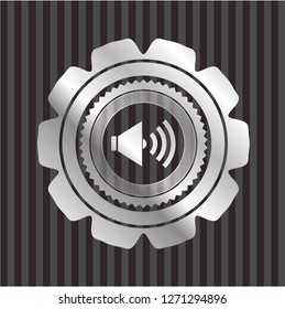 sound icon inside silver badge or emblem