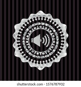 sound icon inside silver badge or emblem