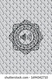 sound icon inside silver badge or emblem. Scales pattern. Vector Illustration. Detailed.