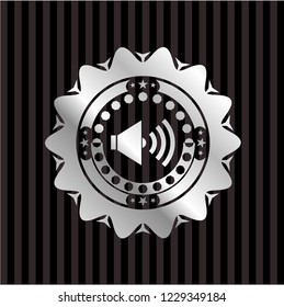 sound icon inside silver emblem or badge