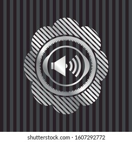 sound icon inside silver emblem