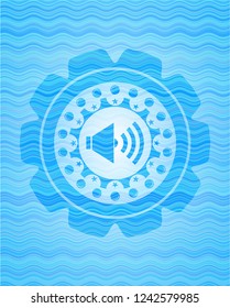 sound icon inside sky blue water wave style emblem.