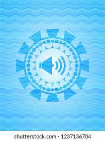 sound icon inside water wave badge background.