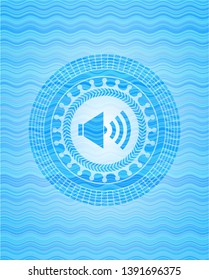 sound icon inside water wave concept badge.