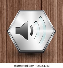 Sound volume symbol icon on hexagon silver button, Vector illustration image on wooden background.