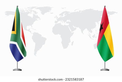 South Africa and Guinea Bissau flags for official meeting against background of world map.