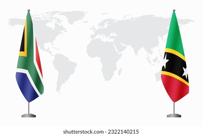 South Africa and Saint Kitts and Nevis flags for official meeting against background of world map.