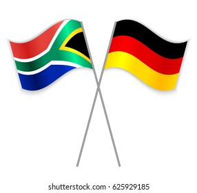 South African and German crossed flags. South Africa combined with Germany isolated on white. Language learning, international business or travel concept.