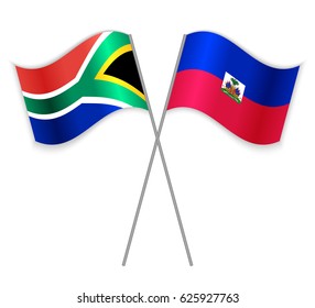 South African and Haitian crossed flags. South Africa combined with Haiti isolated on white. Language learning, international business or travel concept.