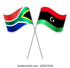 South African and Libyan crossed flags. South Africa combined with Libya isolated on white. Language learning, international business or travel concept.