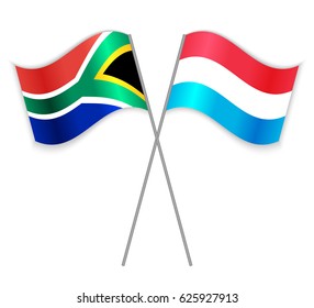 South African and Luxembourgish crossed flags. South Africa combined with Luxembourg isolated on white. Language learning, international business or travel concept.