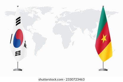 South Korea and Cameroon flags for official meeting against background of world map.
