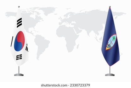 South Korea and Guam flags for official meeting against background of world map.
