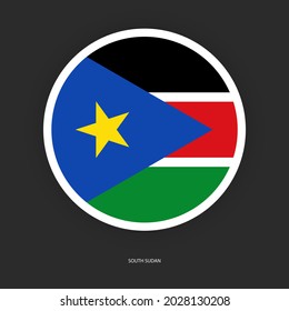 South Sudan circle flag icon on dark grey background. South Sudan button flag icon isolated on barely dark background.