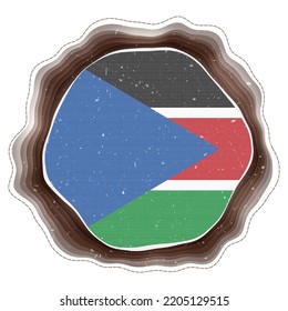 South Sudan flag in frame. Badge of the country. Layered circular sign around South Sudan flag. Captivating vector illustration.