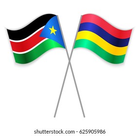 South Sudanese and Mauritian crossed flags. South Sudan combined with Mauritius isolated on white. Language learning, international business or travel concept.