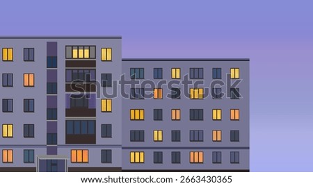 Soviet style apartment buildings during twilight. Cozy evening lights in apartment windows. Facade of a post-soviet panel or block buildings. 