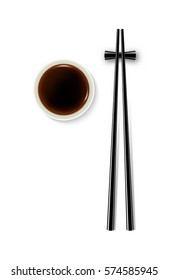 Soy sauce and chopsticks isolated on white background