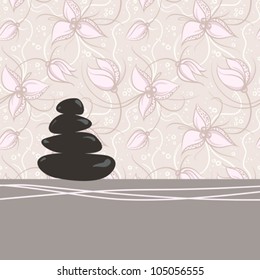 Spa background of black pebble decorated with flowers