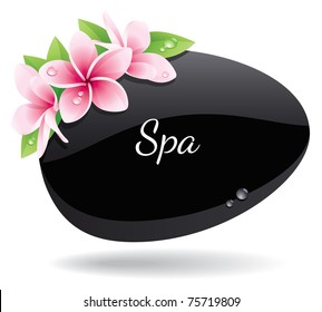 Spa background of black pebble decorated with flowers