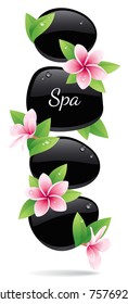 Spa background of black pebbles decorated with flowers