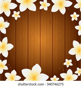 Spa background with frangipani flowers on wooden planks background. 	
Look for web, beauty salon an health center.