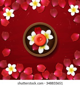  spa background with with red petals and white flowers. Candle in a wooden bowl