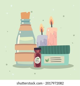 Spa center candles bottle and jars on green background