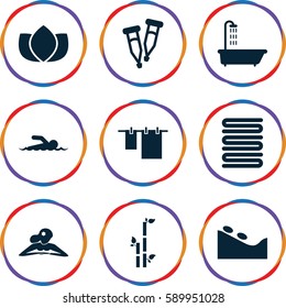 spa icons set. Set of 9 spa filled icons such as shower, lotus, bamboo, towels, cloth hanging, pipette