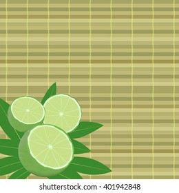 spa leaves and lime in a corner on a bamboo mat background
