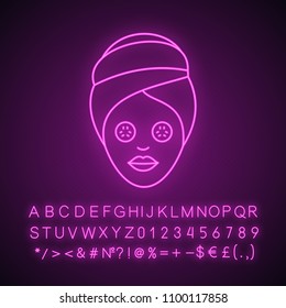 Spa procedure neon light icon. Woman with cucumber facial mask. Glowing sign with alphabet, numbers and symbols. Vector isolated illustration