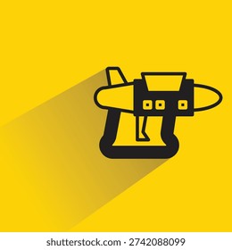 space blaster gun icon with shadow on yellow background