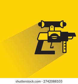 space blaster gun icon with shadow on yellow background