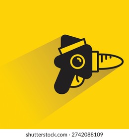 space blaster gun icon with shadow on yellow background