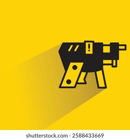 space gun icon with shadow on yellow background